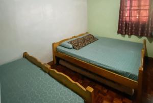 Postel nebo postele na pokoji v ubytování RedDoorz Hostel at MRC Residences Baguio