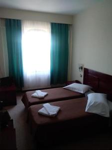Postel nebo postele na pokoji v ubytování Hotel Isaraiko Spiti Agia Theodora