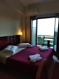 Postel nebo postele na pokoji v ubytování Hotel Isaraiko Spiti Agia Theodora