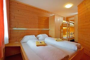 מיטה או מיטות בחדר ב-Appartement Wilder Kaiser, Anni Koller