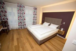 En eller flere senge i et værelse på Genießerhotel Limbacher