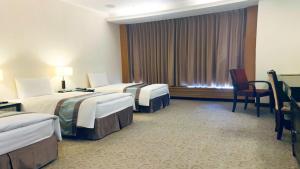 Postel nebo postele na pokoji v ubytování Zhong Ke Hotel