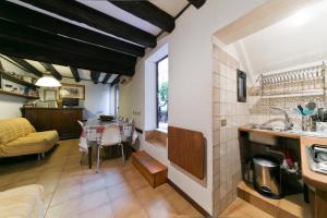 a kitchen and living room with a table and a sink at Ground floor Santa Margherita Apt ac wi-fi in Venice