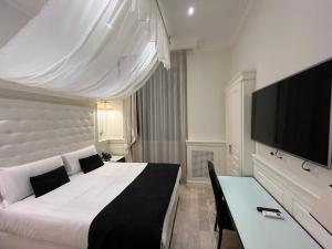TV a/nebo společenská místnost v ubytování Hotel dei Quiriti Suite