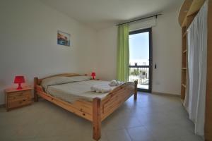 Postel nebo postele na pokoji v ubytování Residence Cala Verde