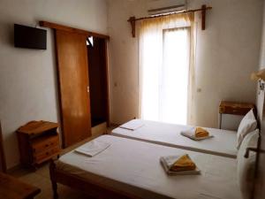 Postel nebo postele na pokoji v ubytování Pension Nikolas
