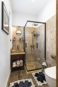 a bathroom with a shower and a sink at ArtCity Villa- Historic Residence in Kapana in Plovdiv