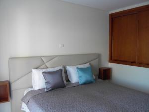 Ένα ή περισσότερα κρεβάτια σε δωμάτιο στο Muralha House