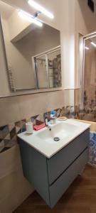a bathroom with a sink and a mirror at La Palma in Rapallo