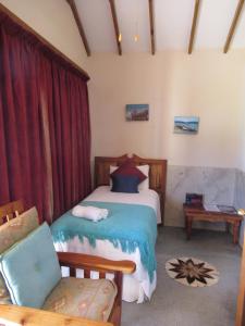 Ένα ή περισσότερα κρεβάτια σε δωμάτιο στο Mountain Pastures Game Lodge