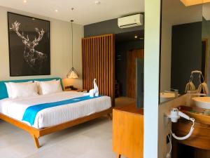 Posteľ alebo postele v izbe v ubytovaní Hotel Dafam Wonosobo