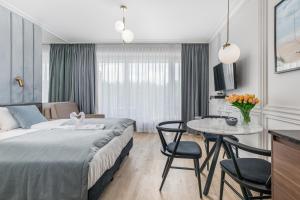 Łóżko lub łóżka w pokoju w obiekcie Apart Park - Stylowe Studio 3 min od PLAŻY by Noclegi Renters