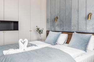 Łóżko lub łóżka w pokoju w obiekcie Apart Park - Stylowe Studio 3 min od PLAŻY by Noclegi Renters