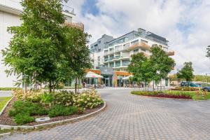 Ogród w obiekcie Apart Park - Stylowe Studio 3 min od PLAŻY by Noclegi Renters