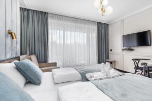 Telewizja i/lub zestaw kina domowego w obiekcie Apart Park - Stylowe Studio 3 min od PLAŻY by Noclegi Renters