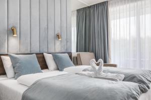Łóżko lub łóżka w pokoju w obiekcie Apart Park - Stylowe Studio 3 min od PLAŻY by Noclegi Renters