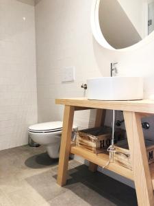 a bathroom with a sink and a toilet at Charming Design House in Montijo, Casa 41 in Montijo