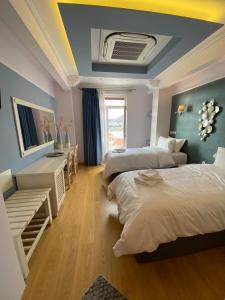 Postel nebo postele na pokoji v ubytování HOTEL TSARSI