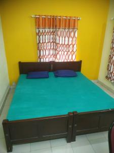 En eller flere senge i et værelse på Tourist home