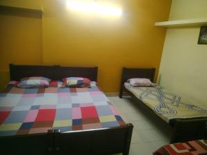 En eller flere senge i et værelse på Tourist home
