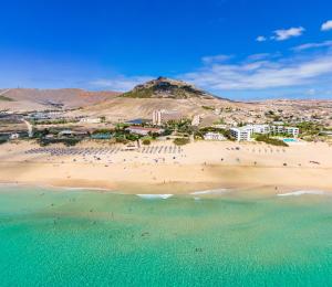 an aerial view of a beach with a group of people at Vila Baleira Suites in Porto Santo