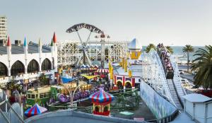 an amusement park with a roller coaster and a carnival at Poets Retreat in Melbourne