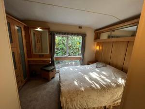 Ένα ή περισσότερα κρεβάτια σε δωμάτιο στο Dedham Lodge