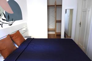 Posteľ alebo postele v izbe v ubytovaní BpR Pastellion Art Home in Buda