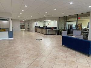 a lobby with a waiting area with chairs and tables at Comfort Inn Conover-Hickory in Conover