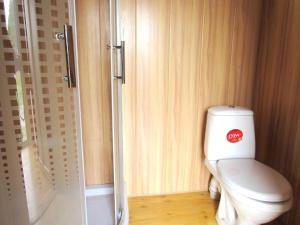 a small bathroom with a toilet and a shower at Arpa Valley Cabin in Yeghegnadzor +46 photos