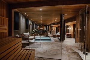 a lobby of a hotel with a swimming pool at Haga Slott in Enköping