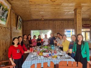 a group of people sitting around a table at Trang An Homestay in Ninh Binh