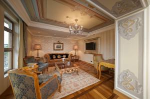 a living room with a couch and a table at Crowne Plaza Istanbul - Old City, an IHG Hotel in Istanbul