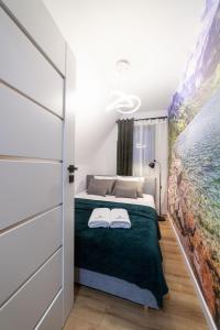 Posteľ alebo postele v izbe v ubytovaní Apartament Koko Białka Tatrzańska