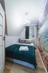 Posteľ alebo postele v izbe v ubytovaní Apartament Koko Białka Tatrzańska