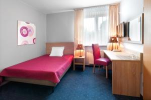 Posteľ alebo postele v izbe v ubytovaní Hotel Petrus