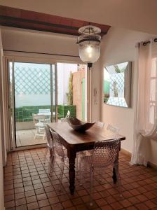 a dining room table with chairs and a bowl on it at 6EGA14 Superbe maison Familiale 6 personnes in Collioure