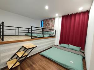 Postel nebo postele na pokoji v ubytování Hoshi DaLat House