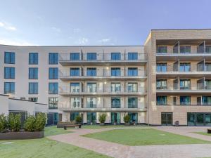 an apartment building with a park in front of it at Limehome Münster Von-Steuben-Str - Digital Access in Münster
