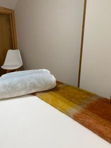 Łóżko lub łóżka w pokoju w obiekcie O SECRETO