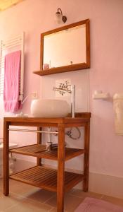 a bathroom with a sink and a mirror at La Nave Monteggio in Monteggio +50 photos