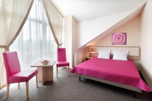 Posteľ alebo postele v izbe v ubytovaní Hotel Petrus