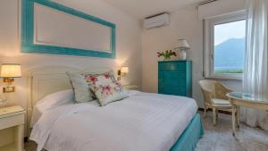 מיטה או מיטות בחדר ב-La Caletta Hotel Bolognese