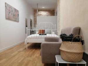 A bed or beds in a room at SALOTUR Sierpes