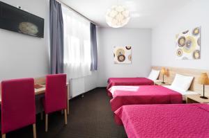 Posteľ alebo postele v izbe v ubytovaní Hotel Petrus