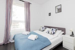 Posteľ alebo postele v izbe v ubytovaní Deluxe Apartments Sucha Gdańsk by Noclegi Renters