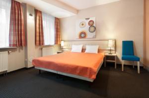 Posteľ alebo postele v izbe v ubytovaní Hotel Petrus