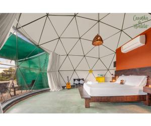 Giường trong phòng chung tại Glamping Serra da Canastra - Casinha de Hortelã - Domo Jaboticaba +5 ảnh