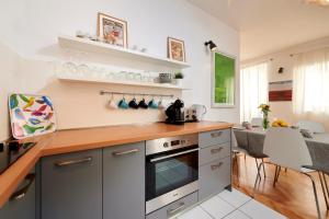 a kitchen with a counter top and a stove top oven at Apartment Tin in Trogir
