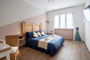 A bed or beds in a room at A Casa di Ale